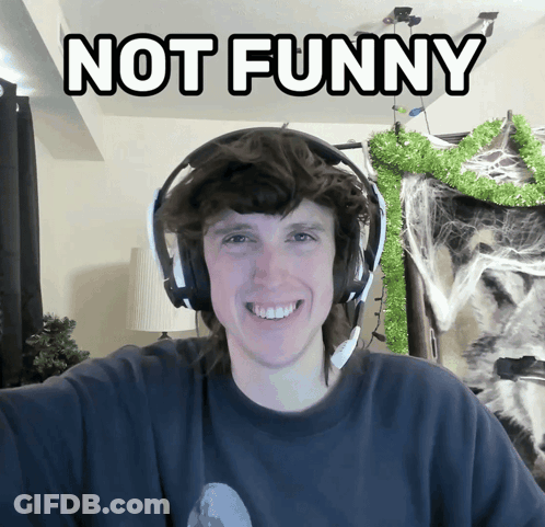 Man With Headphones Says Not Funny GIF
