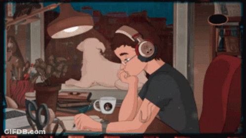 Man With Headphones Sitting At Desk GIF