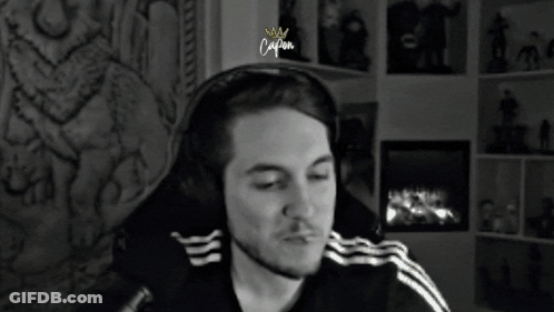 Man With Headphones Sitting By Fireplace Caption GIF