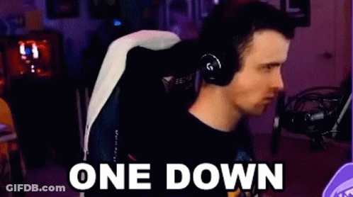 Man With Headphones Sitting In Chair One Down GIF