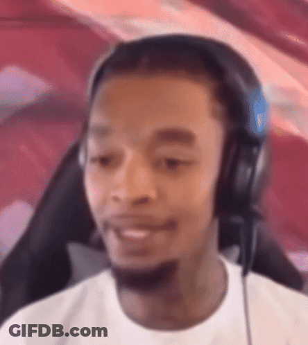 Man With Headphones Sitting In Chair GIF