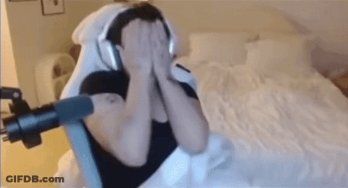 Man With Headphones Sitting On Bed GIF