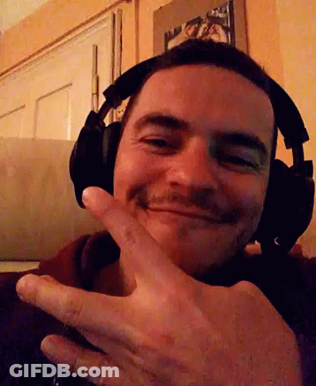 Man With Headphones Smiling And Giving Peace Sign GIF