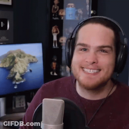 Man With Headphones Smiling At Microphone GIF