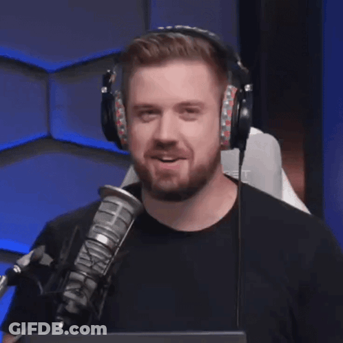Man With Headphones Smiling At Microphone GIF