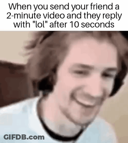 Man With Headphones Smiling Watching Video Saying LOL GIF