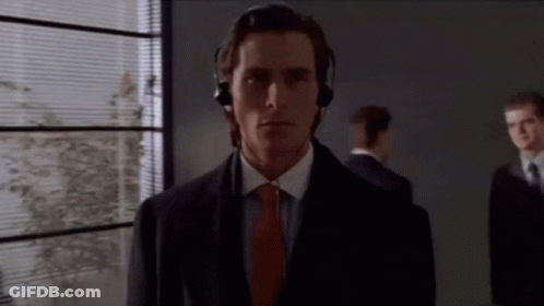 Man With Headphones Standing In Front Of Window GIF