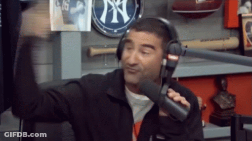 Man With Headphones Talking Into Microphone NY Sign GIF