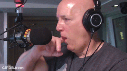 Man With Headphones Talking Into Microphone GIF