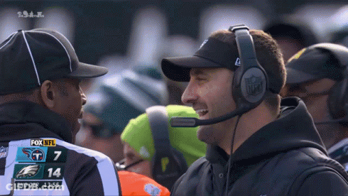 Man With Headphones Talks To Referee Fox NFL Football GIF
