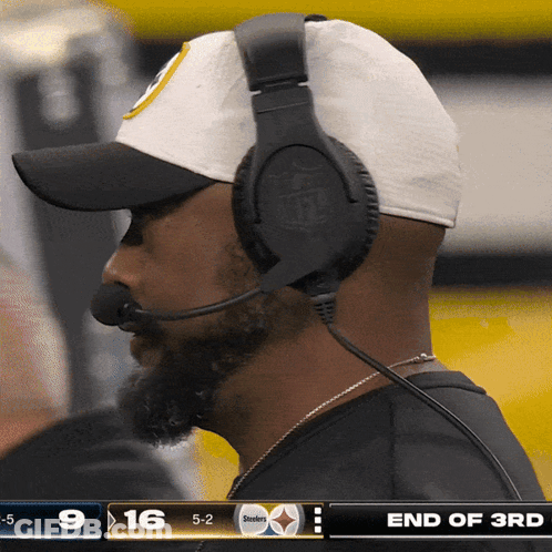Man With Headphones Watching Steelers Vs Bengals GIF