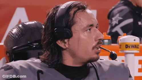 Man With Headset And Microphone In Front Of DeWalt Sign GIF