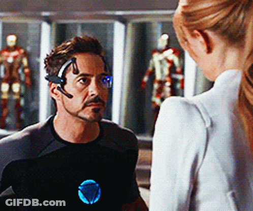 Man With Headset Talking To Woman In White Jacket GIF
