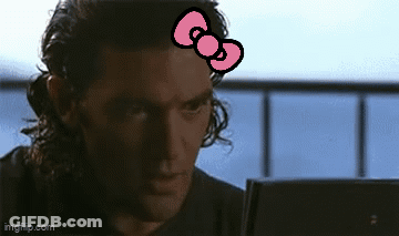 Man With Hello Kitty Bow Looking At Laptop GIF
