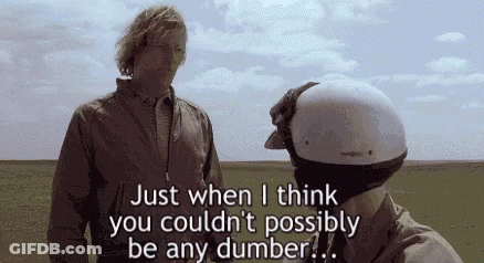 Man With Helmet Standing Next To Another Man In Field GIF