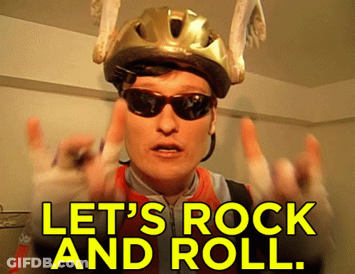 Man With Helmet Sunglasses Bandaged Hand Says Let's Rock And Roll GIF