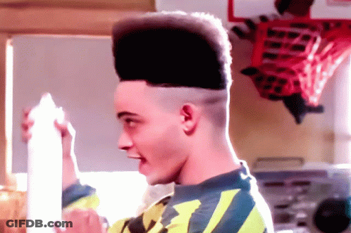 Man With High Top Hairstyle Holding Milk GIF