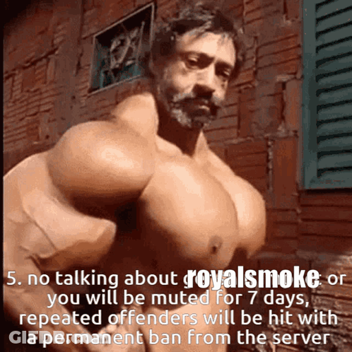 Man With Huge Muscles In Front Of Brick Building GIF