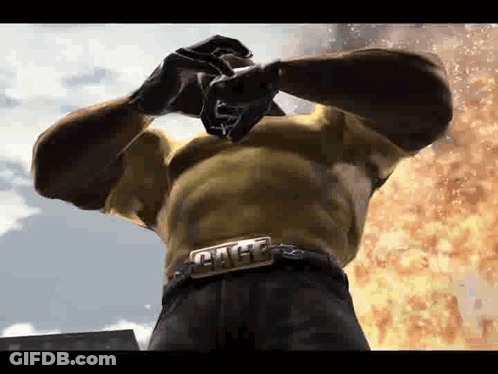 Man With Hulk Belt In Front Of Fire GIF