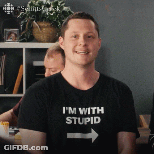Man With I'm With Stupid Shirt GIF