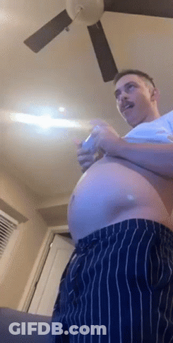 Man With Large Belly Playing Video Game GIF