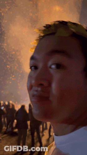Man With Laurel Wreath In Front Of Crowd GIF