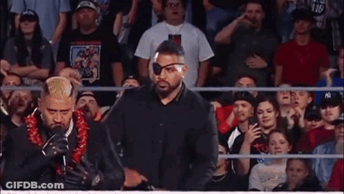 Man With Lei Holding I Love You Sign GIF