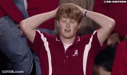 Man With Letter A On Shirt Holding Head GIF