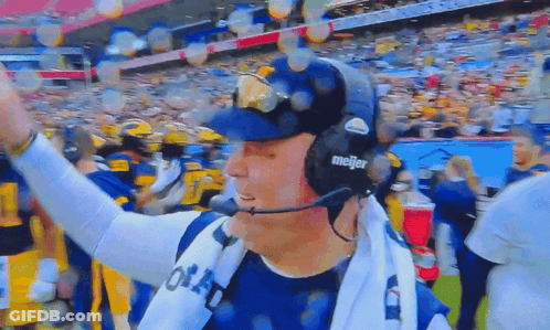 Man With Letter A On Shirt Holding His Head GIF