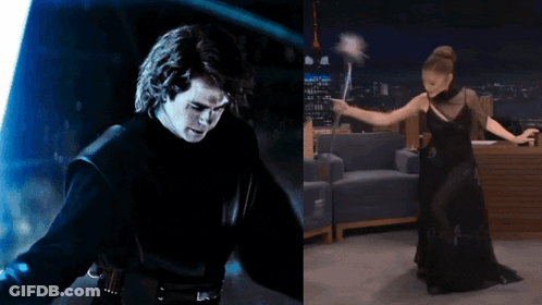 Man With Lightsaber Next To Woman In Black Dress Holding Wand GIF