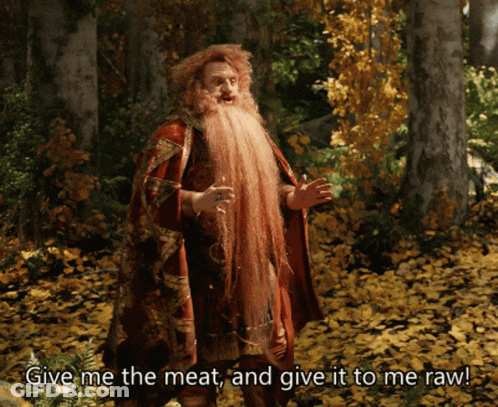 Man With Long Beard In Woods Saying Give Me The Meat And Give It To Me Raw GIF