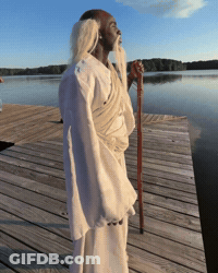Man With Long Beard Standing On Wooden Dock GIF