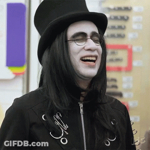 Man With Long Black Hair And Glasses In Top Hat Laughing GIF