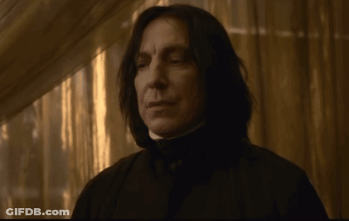 Man With Long Black Hair In Dark Hallway GIF