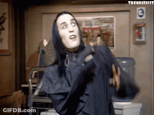 Man With Long Black Hair In Hooded Jacket GIF