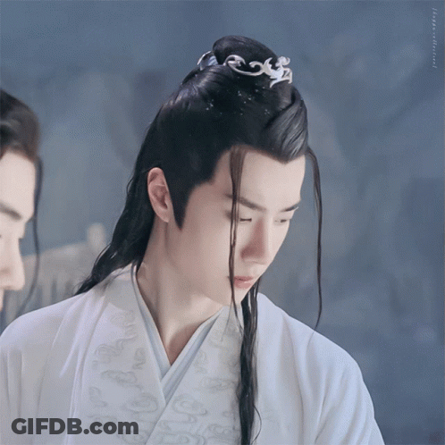 Man With Long Black Hair In White Robe GIF