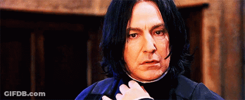Man With Long Black Hair Looking At Camera GIF