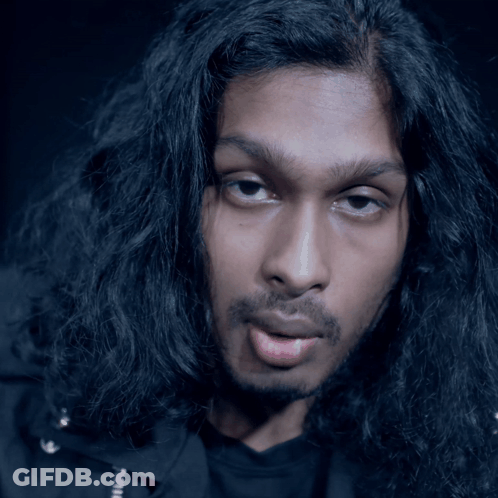 Man With Long Black Hair Making A Face GIF