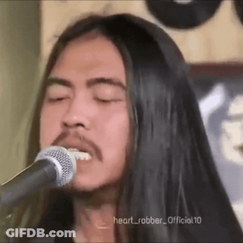 Man With Long Black Hair Singing GIF