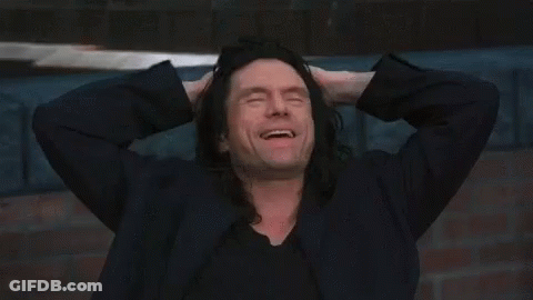 Man With Long Black Hair Smiling Hands To Head GIF
