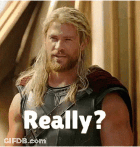 Man With Long Blonde Hair And Beard By Building GIF