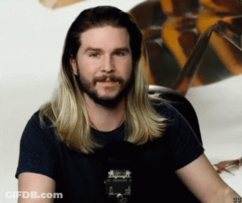 Man With Long Blonde Hair And Beard In Black Shirt With Number 99 GIF