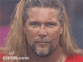 Man With Long Blonde Hair And Beard In Red Wrestling Shirt GIF