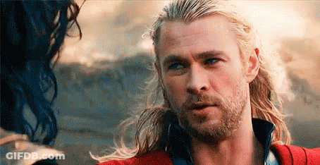 Man With Long Blonde Hair And Beard Next To Woman With Blue Hair GIF