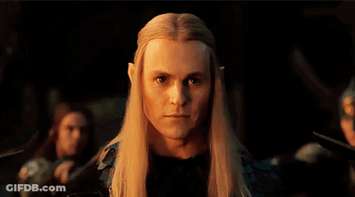 Man With Long Blonde Hair And Ears Looking At Camera GIF