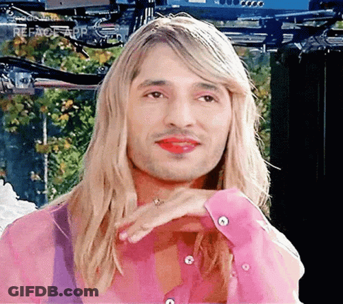 Man With Long Blonde Hair And Red Lipstick GIF