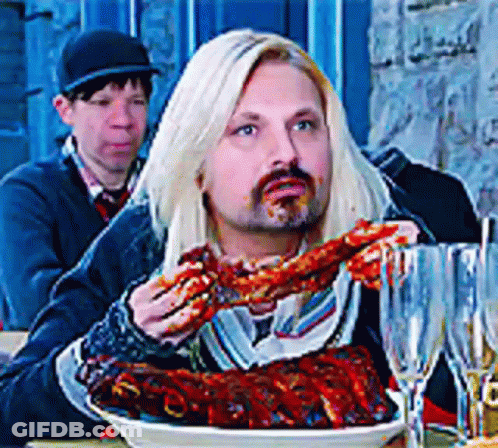 Man With Long Blonde Hair Eating Food GIF