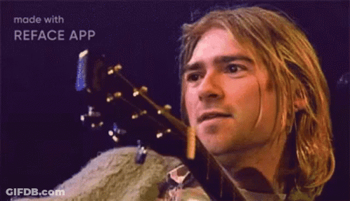 Man With Long Blonde Hair Holding Guitar GIF