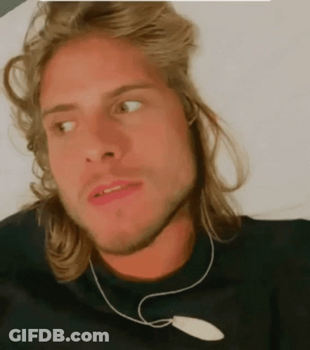Man With Long Blonde Hair In Black Shirt GIF
