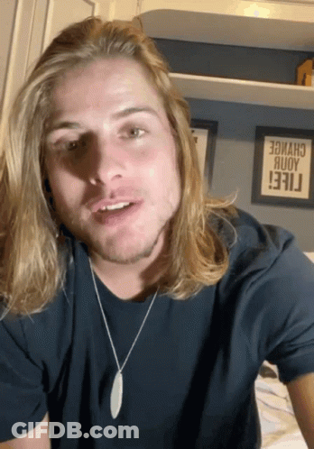 Man With Long Blonde Hair In Black T-Shirt GIF